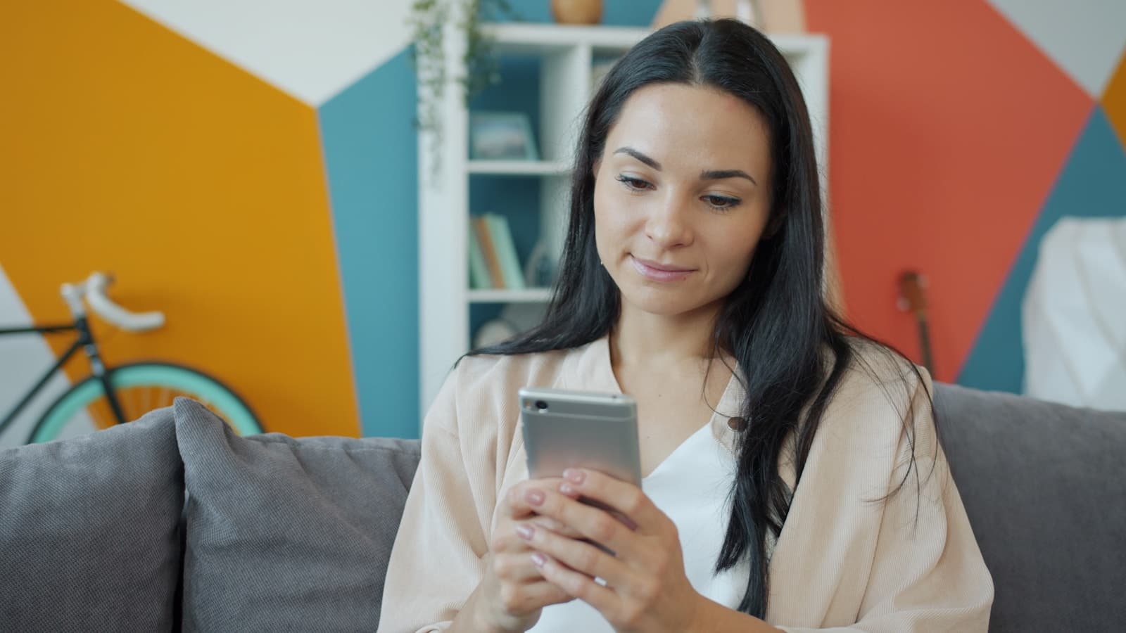 Person relaxed on a couch — fewer calls, more calm.